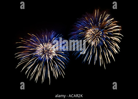 Blue-white light effects in the night skies during the New Year`s Eve fireworks Stock Photo